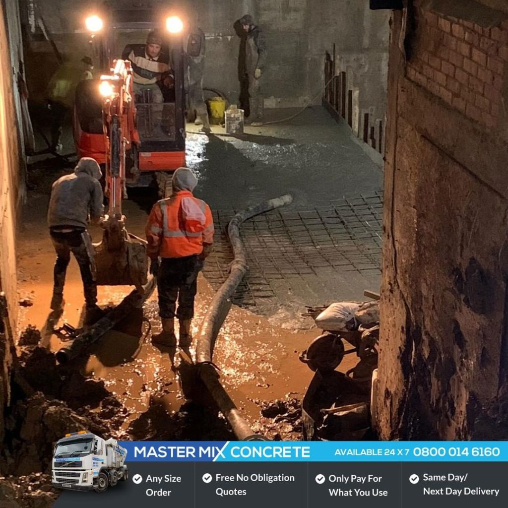 master_mix_concrete_80461161_584210115477761_1154481396923535358_n Master Mix Concrete team delivering concrete with a concrete pump into a basement in Enfield