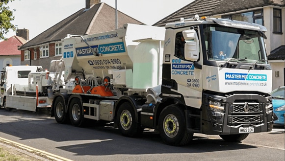 A Master Mix Concrete volumetric concrete mixer on a domestic site
